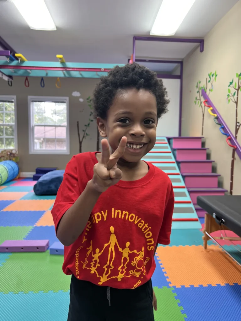 Smiling child in a Therapy Innovations sensory gym