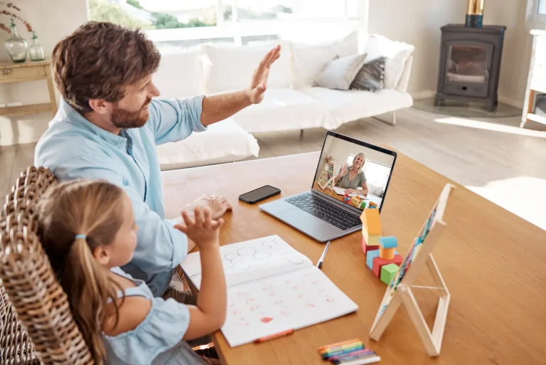 Parent and child meeting with a therapist by video