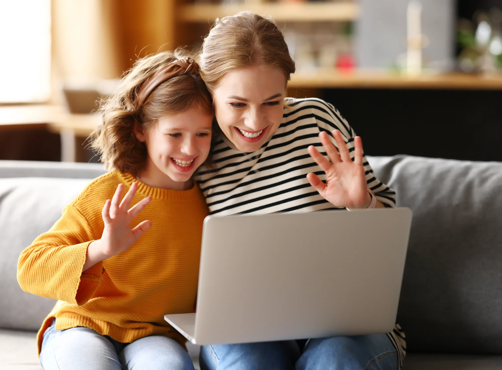 Parent and child using a laptop for coaching consultation